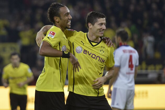 Dortmund's Robert Lewandowski, right, celebrates his goal with Dortmund's other scorer Pierre-Emerick Aubameyang during the German soccer Bundesliga match between Borussia Dortmund and Hamburger SV in Dortmund, Germany, Saturday, Sept. 14, 2013.  (AP Photo/Martin Meissner)