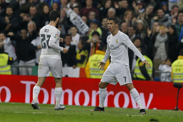 Real Madrid's Cristiano Ronaldo, right, celebrates with teammate Francisco Roman “Isco”  after scoring their side's fourth goal during the Spanish La Liga soccer match between Real Madrid and Espanyol at the Santiago Bernabeu stadium in Madrid, Sunday, Jan. 31, 2016. (AP Photo/Francisco Seco)