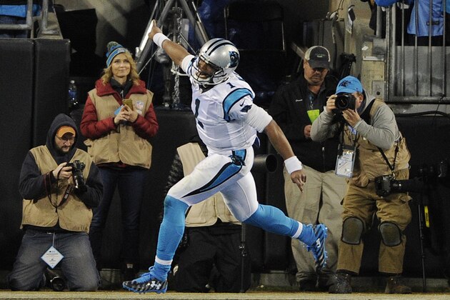 Carolina Panthers' Cam Newton celebrates his touchdown run during the first half the NFL football NFC Championship game against the Arizona Cardinals, Sunday, Jan. 24, 2016, in Charlotte, N.C. (AP Photo/Mike McCarn)