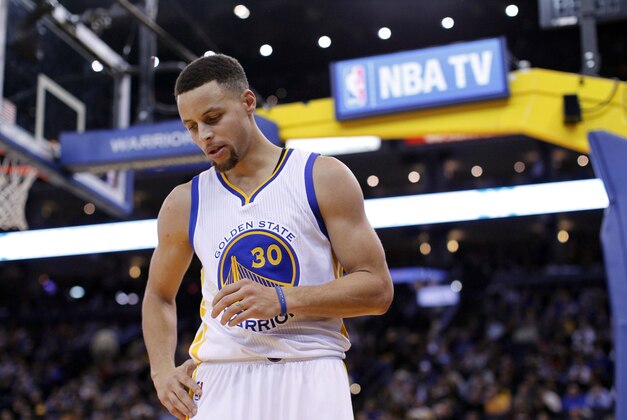 Jan 27, 2016; Oakland, CA, USA; Golden State Warriors guard Stephen Curry (30) holds stands on the floor before inbounding the ball against the Dallas Mavericks in the fourth quarter at Oracle Arena. The Warriors defeated the Mavericks 127-107. Mandatory Credit: Cary Edmondson-USA TODAY Sports