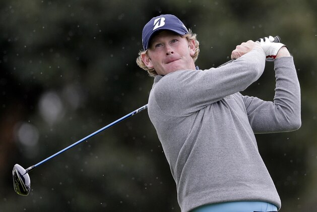 Brandt Snedeker watches his tee shot on the 18th hole during the final round of the Farmers Insurance Open golf tournament Sunday, Jan. 31, 2016, in San Diego. (AP Photo/Gregory Bull)