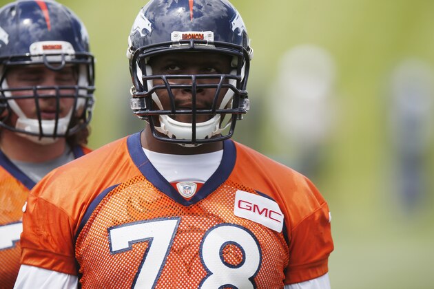 In this photo taken Wednesday, May 27, 2015, Denver Broncos offensive tackle Ryan Clady waits to take part in drills during an NFL football organized team activity at the team's headquarters in Englewood, Colo. Broncos officials announced Thursday, May 28, 2015, that Clady tore his left ACL while taking part in Wednesday's session, an injury that is likely to shelve the veteran offensive lineman for the season. (AP Photo/David Zalubowski)