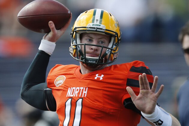 North Dakota State quarterback Carson Wentz warms up before the Senior Bowl NCAA college football game, Saturday, Jan. 30, 2016, at Ladd–Peebles Stadium, in Mobile, Ala. (AP Photo/Brynn Anderson)