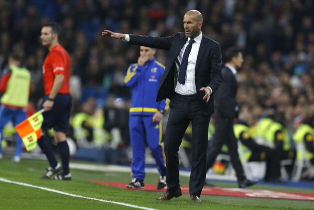 Real Madrid's head coach Zinedine Zidane gives instructions from the side line during the Spanish La Liga soccer match between Real Madrid and Espanyol at the Santiago Bernabeu stadium in Madrid, Sunday, Jan. 31, 2016. Real Madrid defeated Espanyol 6-0. (AP Photo/Francisco Seco)