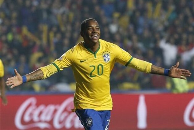 Brazil's Robinho celebrates after scoring the opening goal during a Copa America quarterfinal soccer match against Paraguay at the Ester Roa Rebolledo Stadium in Concepcion, Chile, Saturday, June 27, 2015. (AP Photo/Silvia Izquierdo)