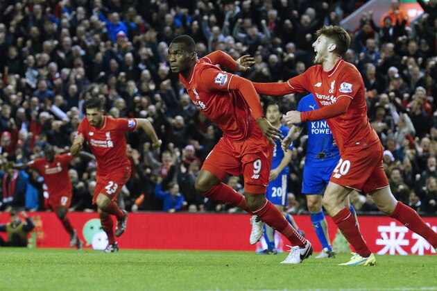 Liverpool's Zaire-born Belgian striker Christian Benteke (2nd L) celebrates with teammates after scoring the opening goal of during the English Premier League football match between Liverpool and Leicester City at the Anfield stadium in Liverpool, north-west England on December 26, 2015.  AFP PHOTO / LINDSEY PARNABY

RESTRICTED TO EDITORIAL USE. No use with unauthorized audio, video, data, fixture lists, club/league logos or 'live' services. Online in-match use limited to 75 images, no video emulation. No use in betting, games or single club/league/player publications. / AFP / LINDSEY PARNABY        (Photo credit should read LINDSEY PARNABY/AFP/Getty Images)