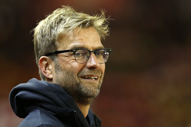 Liverpool's manager Juergen Klopp stands pitch side ahead of the English League Cup semifinal second leg soccer match between Liverpool and Stoke City at Anfield stadium in Liverpool, England, Tuesday, Jan. 26, 2016. (AP Photo/Jon Super)