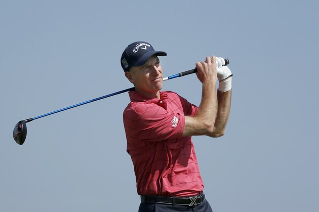 Jim Furyk watches his drive on the 10th tee during the first round of the BMW Championship golf tournament at Conway Farms Golf Club, Thursday, Sept. 17, 2015, in Lake Forest, Ill. Furyk withdrew from the tournament citing a left wrist injury. (AP Photo/Charles Rex Arbogast)