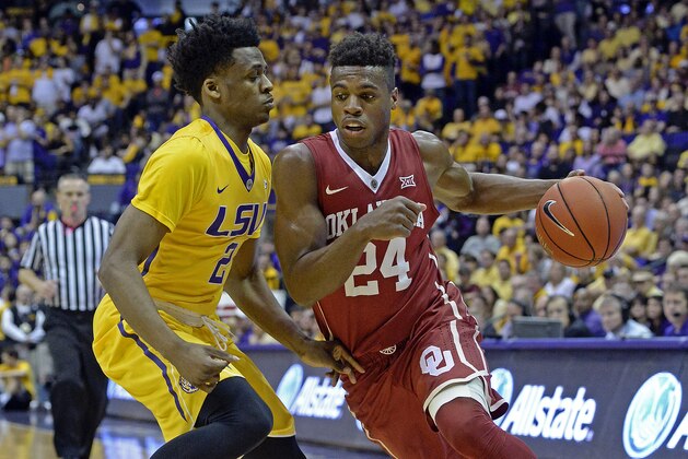 Oklahoma guard Buddy Hield (24) drives to the basket as LSU guard Antonio Blakeney (2) defends in the first half of an NCAA college basketball game in Baton Rouge, La., Saturday, Jan. 30, 2016. (AP Photo/Bill Feig)