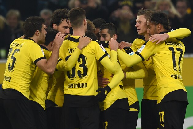 Dortmund's Armenian midfielder Henrikh Mkhitaryan and his teammates celebrate a second goal during the German first division football Bundesliga match Moenchengladbach vs Dortmund in Moenchengladbach, western Germany, on January 23, 2016. / AFP / PATRIK STOLLARZ / RESTRICTIONS: DURING MATCH TIME: DFL RULES TO LIMIT THE ONLINE USAGE TO 15 PICTURES PER MATCH AND FORBID IMAGE SEQUENCES TO SIMULATE VIDEO. == RESTRICTED TO EDITORIAL USE == FOR FURTHER QUERIES PLEASE CONTACT DFL DIRECTLY AT + 49 69 650050
        (Photo credit should read PATRIK STOLLARZ/AFP/Getty Images)