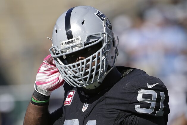 Oakland Raiders defensive end Justin Tuck (91) during the second half of an NFL football game against the Denver Broncos in Oakland, Calif., Sunday, Oct. 11, 2015. (AP Photo/Marcio Jose Sanchez)