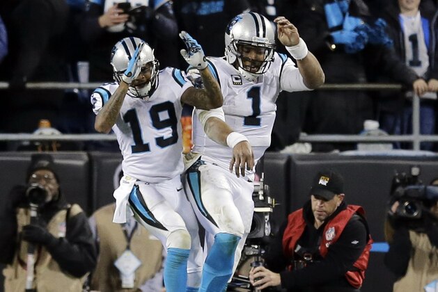 Carolina Panthers' Cam Newton celebrates his touchdown run with Ted Ginn (19) during the second half the NFL football NFC Championship game against the Arizona Cardinals Sunday, Jan. 24, 2016, in Charlotte, N.C. (AP Photo/David J. Phillip)
