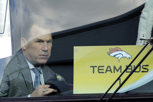 Denver Broncos head coach Gary Kubiak gets on a bus as they arrive at the Mineta San Jose International Airport for the NFL Super Bowl football game Sunday, Jan. 31, 2016, in San Jose, Calif.  The Broncos play the Carolina Panthers on Sunday, Feb. 7, 2015, in Super Bowl 50. (AP Photo/David J. Phillip)