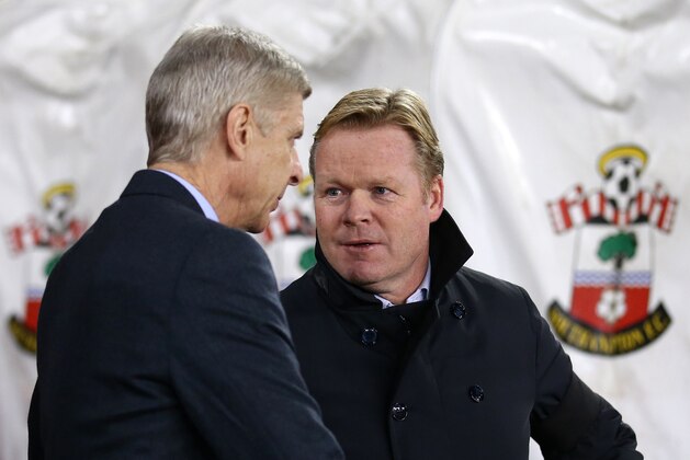 Southampton's Dutch manager Ronald Koeman (R) greets Arsenal's French manager Arsene Wenger ahead of the English Premier League football match between Southampton and Arsenal at St Mary's Stadium in Southampton, southern England on December 26, 2015. AFP PHOTO / JUSTIN TALLIS

RESTRICTED TO EDITORIAL USE. NO USE WITH UNAUTHORIZED AUDIO, VIDEO, DATA, FIXTURE LISTS, CLUB/LEAGUE LOGOS OR 'LIVE' SERVICES. ONLINE IN-MATCH USE LIMITED TO 75 IMAGES, NO VIDEO EMULATION. NO USE IN BETTING, GAMES OR SINGLE CLUB/LEAGUE/PLAYER PUBLICATIONS. / AFP / JUSTIN TALLIS        (Photo credit should read JUSTIN TALLIS/AFP/Getty Images)