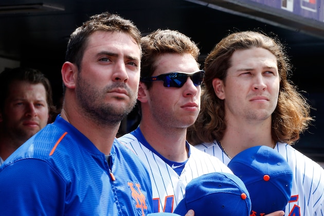 NEW YORK, NY - JULY 12:  (L-R) Matt Harvey #33, Steven Matz #32 and Jacob deGrom #48 of the New York Mets look on against the Arizona Diamondbacks at Citi Field on July 12, 2015 in the Flushing neighborhood of the Queens borough of New York City. The Mets defeated the Diamondbacks 5-3.  (Photo by Jim McIsaac/Getty Images)