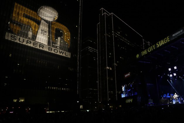 Chris Isaak performs on opening night at Super Bowl City Saturday, Jan. 30, 2016, in San Francisco. The Denver Broncos will play the Carolina Panthers in Super Bowl 50 Sunday, Feb. 7, 2016. (AP Photo/David J. Phillip)