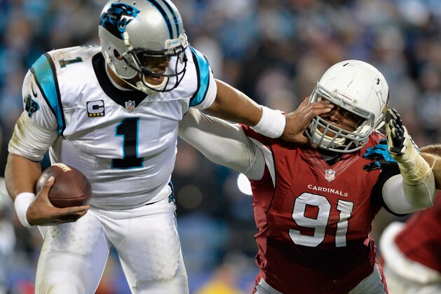 CHARLOTTE, NC - JANUARY 24:  Cam Newton #1 of the Carolina Panthers stiff arms Ed Stinson #91 of the Arizona Cardinals in the second half during the NFC Championship Game at Bank of America Stadium on January 24, 2016 in Charlotte, North Carolina.  (Photo by Grant Halverson/Getty Images)
