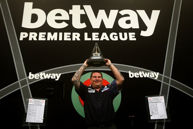 LONDON, ENGLAND - MAY 21: Gary Anderson of Scotland celebrates with the trophy after winning the Final against Michael van Gerwen of Holland during the Betway Premier League at The 02 Arena on May 21, 2015 in London, England. (Photo by Charlie Crowhurst/Getty Images)