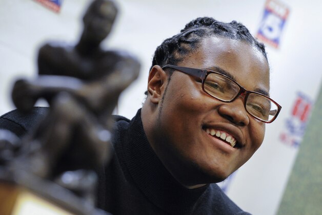FILE - In this Thursday, Jan. 28, 2016, file photo, defensive lineman Rashan Gary, of Paramus, N.J., talks to reporters at the Touchdown Club of Atlanta, in Atlanta. Gary, a defensive tackle from Paramus Catholic High School, is the No. 1 recruit in the country according to ESPN, Rivals, Scout and 247Sports. That kind of unanimity atop the rankings is fairly unusual and suggests that Gary could indeed become a star at the college level. (AP Photo/John Amis, File)