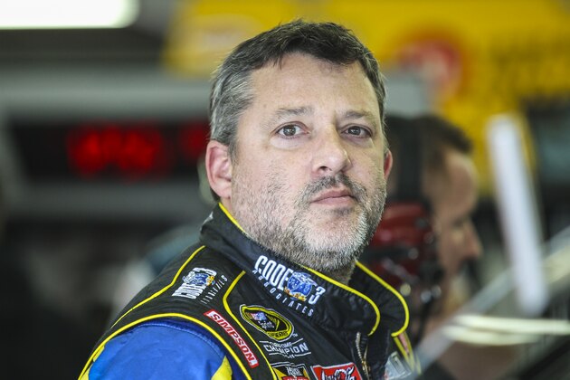 Driver Tony Stewart waits in the garage while his car is worked on during practice for the Sunday's NASCAR Sprint Cup series auto race at New Hampshire Motor Speedway in Loudon, N.H., Friday, Sept. 25, 2015  (AP Photo/Cheryl Senter)