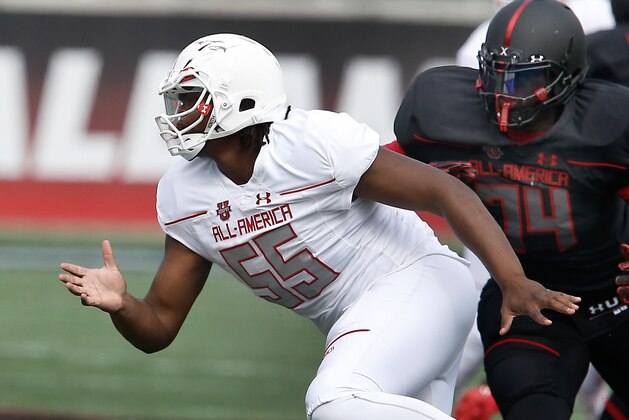 Jan 2, 2016; Orlando, FL, USA; Team Highlight player Jean Delancey (74) chases Team Highlight player Rashawn Gary (55) in the Under Armour All American Football Game at the Orlando Citrus Bowl. Team Highlight beat Team Armour 27-0. Mandatory Credit: Reinhold Matay-USA TODAY Sports
