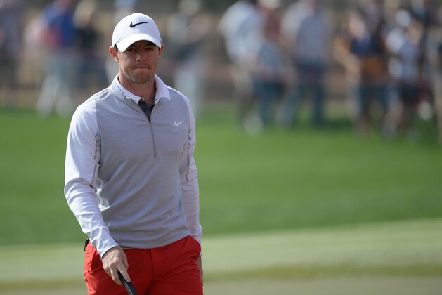 Rory McIlroy of Northern Ireland walks on the 17th green during the round two of the fog-delayed Abu Dhabi Golf Championship in Abu Dhabi, United Arab Emirates, Saturday, Jan. 23, 2016. (AP Photo/Martin Dokoupil)