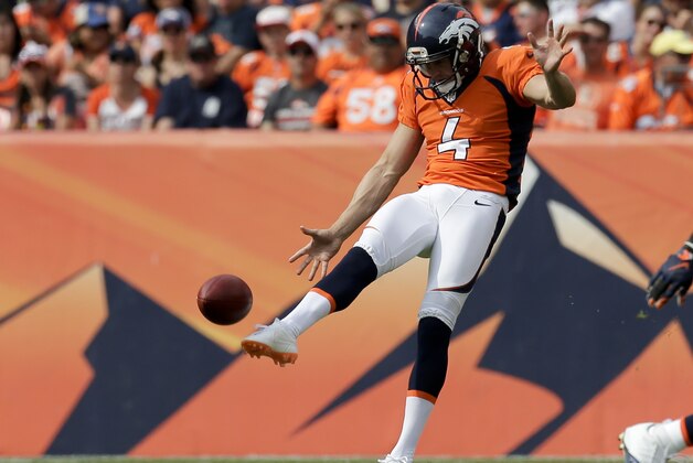 Denver Broncos punter Britton Colquitt punts against the Baltimore Ravens during the first half of an NFL football game Sunday, Sept. 13, 2015, in Denver. (AP Photo/Joe Mahoney)