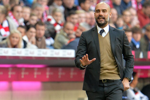 Munich head coach Pep Guardiola   gestures during the German Bundesliga soccer match between FC Bayern Munich and FC Cologne in the Allianz Arena in Munich, Germany, on Saturday, Oct. 24, 2015. (AP Photo/Kerstin Joensson)