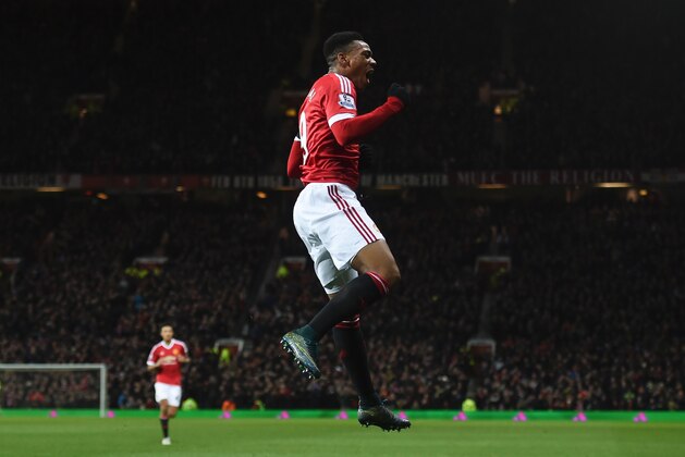 Manchester United's French striker Anthony Martial celebrates scoring their second goal during the English Premier League football match between Manchester United and Stoke City at Old Trafford in Manchester, north west England, on February 2, 2016. / AFP / PAUL ELLIS / RESTRICTED TO EDITORIAL USE. No use with unauthorized audio, video, data, fixture lists, club/league logos or 'live' services. Online in-match use limited to 75 images, no video emulation. No use in betting, games or single club/league/player publications.  /         (Photo credit should read PAUL ELLIS/AFP/Getty Images)