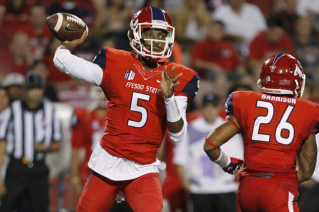 Fresno State's Chason Virgil passes off against Abilene Christian during the first half of an NCAA college football game in Fresno, Calif., Thursday, Sept. 3, 2015. (AP Photo/Gary Kazanjian)