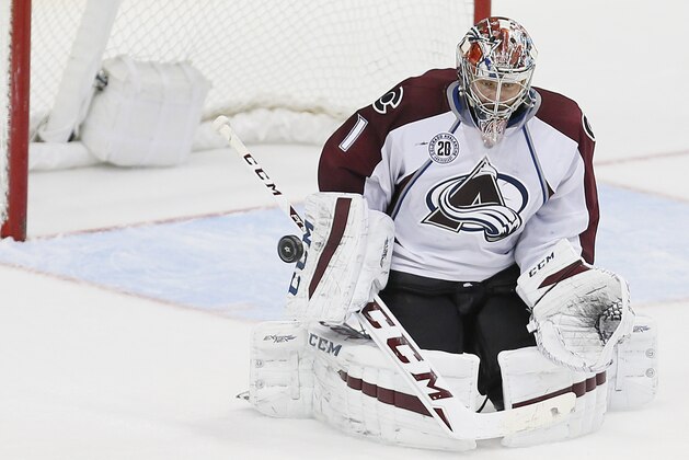 Colorado Avalanche goalie Semyon Varlamov (1) deflects a shot on goal during the third period of an NHL hockey game against the Dallas Stars Saturday, January 23, 2016, in Dallas. Colorado won 3-1. (AP Photo/Brandon Wade)