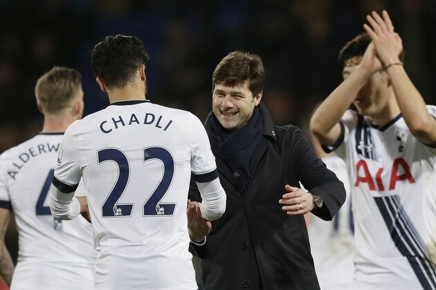 Tottenham manager Mauricio Pochettino, centre, congratulates Tottenham’s Nacer Chadli after the English Premier League soccer match between Crystal Palace and Tottenham Hotspur at Selhurst Park in London, Saturday Jan. 23, 2016. (AP Photo/Tim Ireland)