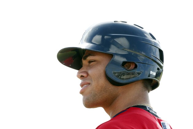 Boston Red Sox' Yoan Moncada waits to bat during practices at spring training, Friday, March 13, 2015, in Fort Myers Fla. The Red Sox have finalized a minor league contract with the 19-year-old Cuban infielder that includes a $31.5 million signing bonus, easily a record for an international amateur free agent under 23 years old. (AP Photo/Brynn Anderson)