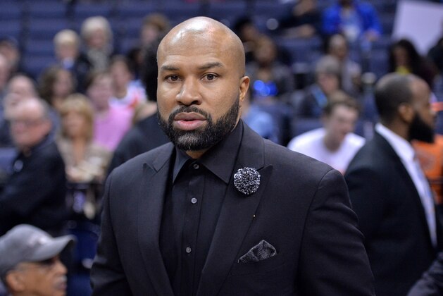 New York Knicks head coach Derek Fisher walks on to the court before an NBA basketball game Saturday, Jan. 16, 2016, in Memphis, Tenn. (AP Photo/Brandon Dill)