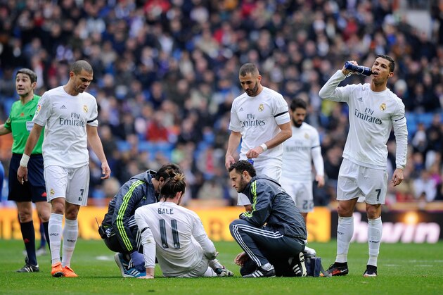 MADRID, SPAIN - JANUARY 17:  Gareth Bale of Real Madrid lies injured during the La Liga match between Real Madrid CF and Sporting Gijon at Estadio Santiago Bernabeu on January 17, 2016 in Madrid, Spain.  (Photo by Denis Doyle/Getty Images)