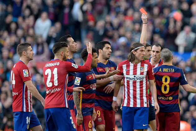 Atletico Madrid's Brazilian defender Filipe Luis (2ndR) looks on after he was shown a red card during the Spanish league football match FC Barcelona vs Club Atletico de Madrid at the Camp Nou stadium in Barcelona on January 30, 2016.   AFP PHOTO/ JOSEP LAGO / AFP / JOSEP LAGO        (Photo credit should read JOSEP LAGO/AFP/Getty Images)