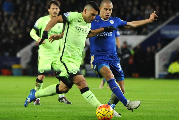 Manchester City’s Sergio Aguero, left. is tackled by Leicester’s Gokhan Inler during the English Premier League soccer match between Leicester City and Manchester City at the King Power Stadium in Leicester, England, Tuesday, Dec. 29, 2015. (AP Photo/Rui Vieira)