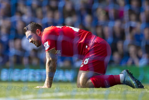 In this Sunday Oct. 4, 2015 file photo, Liverpool's Danny Ings kneels on the pitch after a fall during the English Premier League soccer match between Everton and Liverpool at Goodison Park Stadium, Liverpool, England. According to British media reports on Thursday Oct. 15, 2015, Danny Ings will probably not be playing for most of this season after sustaining a cruciate knee ligament injury, although Liverpool hasn't officially confirmed the injury.(AP Photo/Jon Super, FILE)