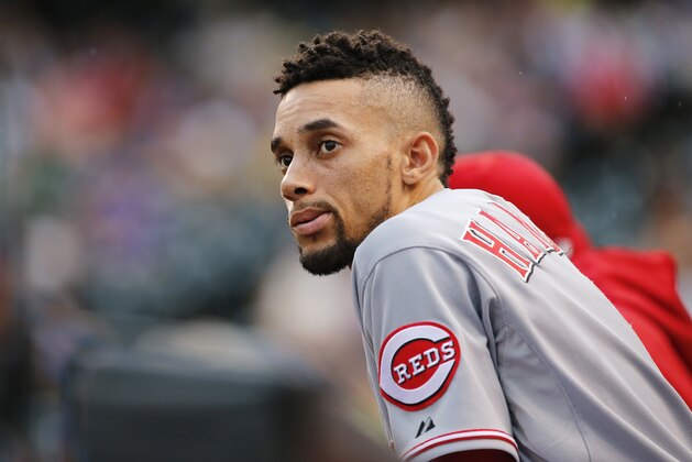 Cincinnati Reds center fielder Billy Hamilton looks on against the Colorado Rockies during the first inning of a baseball game, Friday, July 24, 2015, in Denver. (AP Photo/Jack Dempsey)