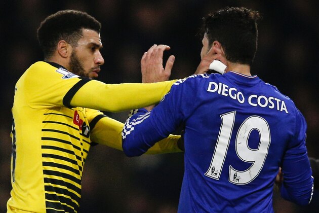 Watford's French midfielder Etienne Capoue (L) confronts Chelsea's Brazilian-born Spanish striker Diego Costa (R) after Costa bundled over Watford's Ecuadorian defender Juan Carlos Paredes in an off the ball incident, one of two between the two players, for which both Paredes and Costa were shown the yellow card during the English Premier League football match between Watford and Chelsea at Vicarage Road Stadium in Watford, north of London on February 3, 2016. / AFP / ADRIAN DENNIS / RESTRICTED TO EDITORIAL USE. No use with unauthorized audio, video, data, fixture lists, club/league logos or 'live' services. Online in-match use limited to 75 images, no video emulation. No use in betting, games or single club/league/player publications.  /         (Photo credit should read ADRIAN DENNIS/AFP/Getty Images)