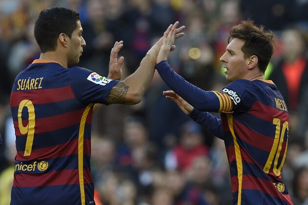 Barcelona's Argentinian forward Lionel Messi (R) celebrates a goal with Barcelona's Uruguayan forward Luis Suarez (L) during the Spanish league football match FC Barcelona vs Granada CF at the Camp Nou stadium in Barcelona on January 9, 2016.   AFP PHOTO / LLUIS GENE / AFP / LLUIS GENE        (Photo credit should read LLUIS GENE/AFP/Getty Images)