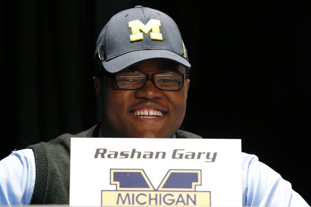 Paramus Catholic High School defensive tackle Rashan Gary, a top high school football recruit, smiles during a school rally following the television announcement in which he declare he intends on playing college football at Michigan on national signing day, Wednesday, Feb. 3, 2016, in Paramus, N.J. (AP Photo/Julio Cortez)