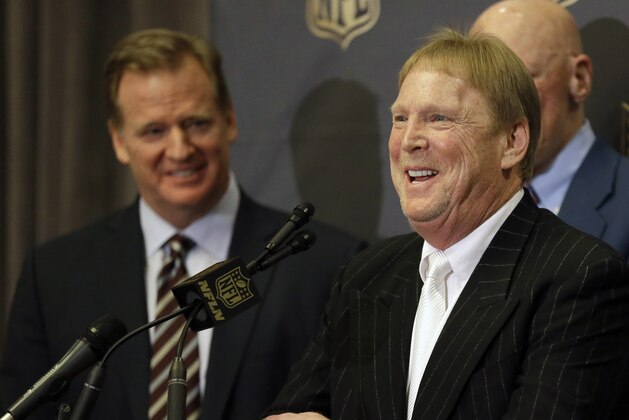 NFL Commissioner Roger Goodell, left, laughs as Oakland Raiders owner Mark Davis talks to the media after an NFL owners meeting Tuesday, Jan. 12, 2016, in Houston. The owners voted to allow the St. Louis Rams to move to a new stadium just outside Los Angeles, and the San Diego Chargers will have an option to share the facility. The Raiders, who also wanted to move to the area, could move to Los Angeles if San Diego doesn't. (AP Photo/Pat Sullivan)