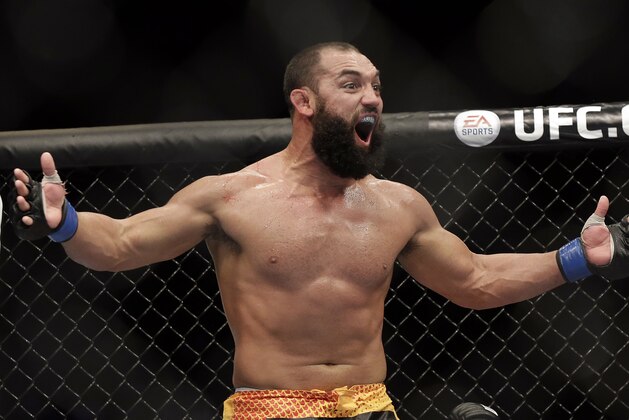 Johny Hendricks reacts following a UFC 167 mixed martial arts championship welterweight bout against Georges St. Pierre, of Canada, on Saturday, Nov. 16, 2013, in Las Vegas. St. Pierre won by split decision. (AP Photo/Isaac Brekken)