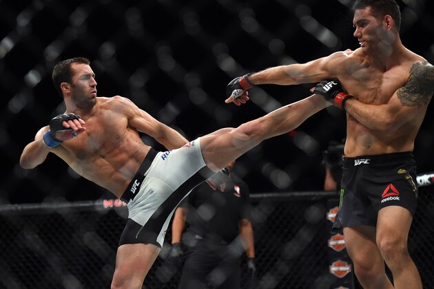 LAS VEGAS, NEVADA - DECEMBER 12:  (L-R) Luke Rockhold kicks Chris Weidman in their middleweight championship bout during the UFC 194 event inside MGM Grand Garden Arena on December 12, 2015 in Las Vegas, Nevada.  (Photo by Jeff Bottari/Zuffa LLC/Zuffa LLC via Getty Images)
