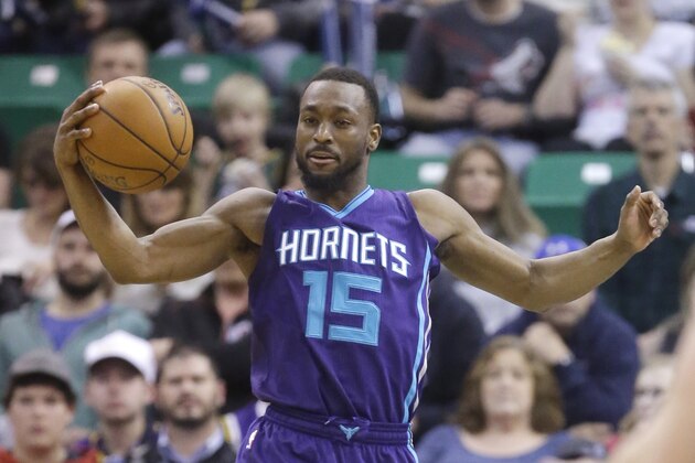 Charlotte Hornets guard Kemba Walker (15) grabs a rebound against the Utah Jazz during the second half in an NBA basketball game Wednesday, Jan. 27, 2016, in Salt Lake City. The Jazz won 102-73. (AP Photo/Rick Bowmer)