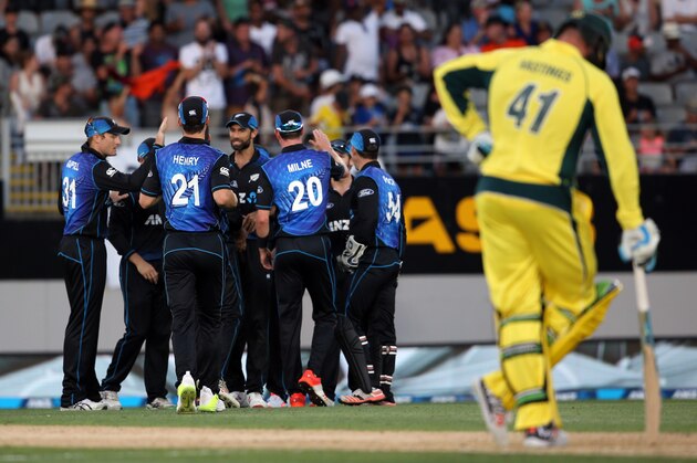 New Zealand's players celebrate the wicket of Australia's Kane Richardson (not in picture) during the first one-day international cricket match between New Zealand and Australia at Eden Park in Auckland on February 3, 2016.   AFP PHOTO / MICHAEL BRADLEY / AFP / MICHAEL BRADLEY        (Photo credit should read MICHAEL BRADLEY/AFP/Getty Images)