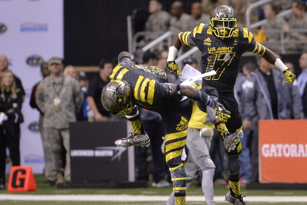 East's Tyler Byrd (17) celebrates with teammate Jaleel Laguins after making an interception during the first half of the Army All American Bowl high school football game against the West, Saturday, Jan. 9, 2016, in San Antonio. (AP Photo/Darren Abate)