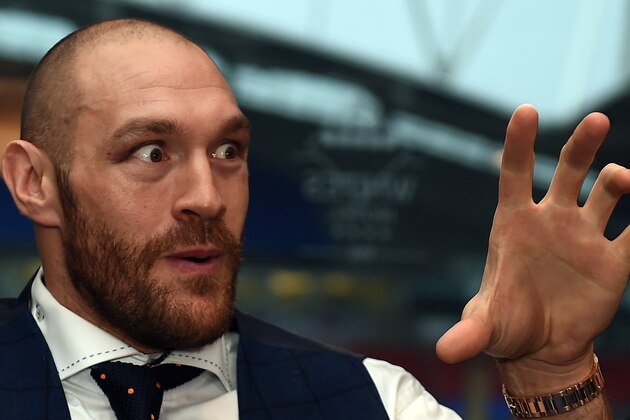 Britain's world heavyweight champion Tyson Fury speaks during a press conference in Bolton, north west England on November 30, 2015. Tyson Fury was crowned the new world heavyweight champion on November 28, ending Wladimir Klitschko's nine-year reign as champion in 12 rounds. AFP PHOTO / PAUL ELLIS / AFP / PAUL ELLIS        (Photo credit should read PAUL ELLIS/AFP/Getty Images)