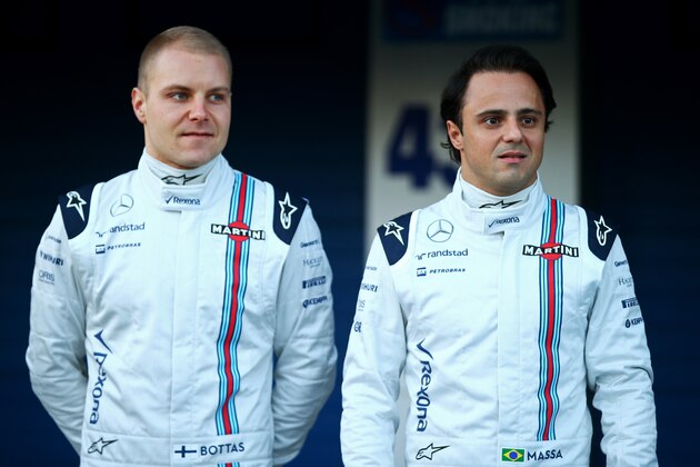 JEREZ DE LA FRONTERA, SPAIN - FEBRUARY 01:  Felipe Massa of Brazil and Williams and Valtteri Bottas of Finland and Williams pose with the new FW37 outside the garage during day one of Formula One Winter Testing at Circuito de Jerez on February 1, 2015 in Jerez de la Frontera, Spain.  (Photo by Mark Thompson/Getty Images)